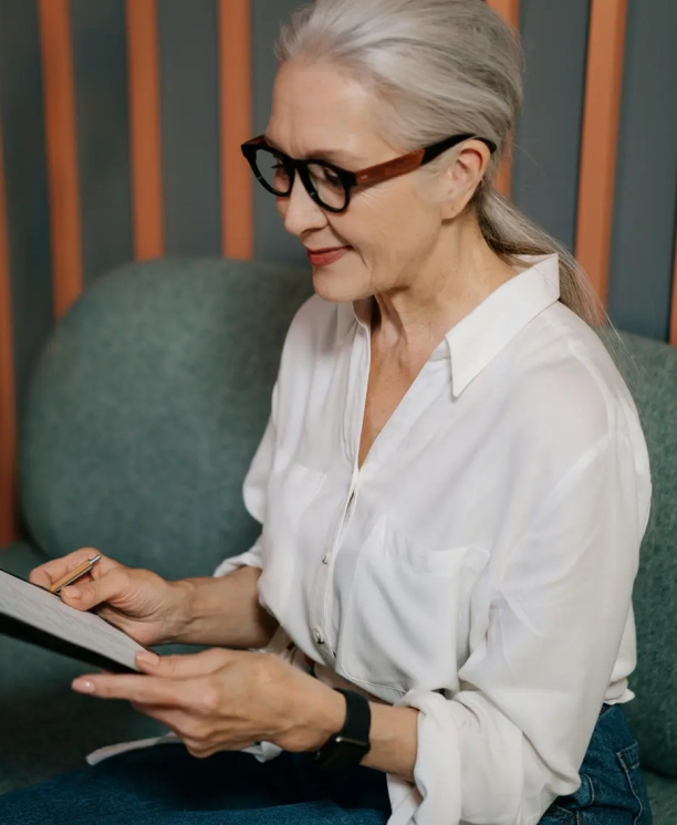 Business consultant reviewing financial documents – A New Horizon Consulting